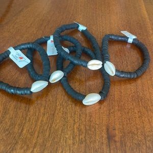 black clay beaded bracelet with seashell charm